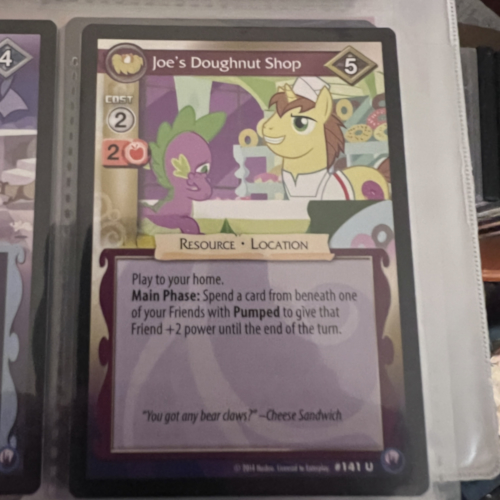 Photograph of a My Little Pony trading card 'Critter Stampede' with the quote 'Hey, you got weasels on your face' attributed to Cheese Sandwich.